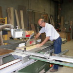 Clete cuts material at Cascade Casework in Albany OR