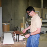 Erik prepares cabinet components at Cascade Casework in Albany OR
